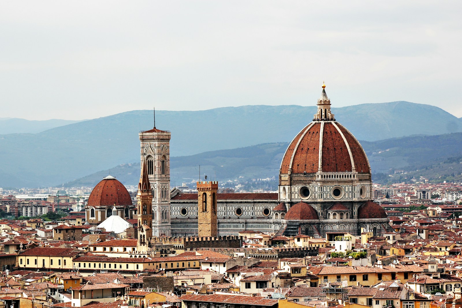 The dome of Florence Cathedral rising over the terracotta rooftops of the city