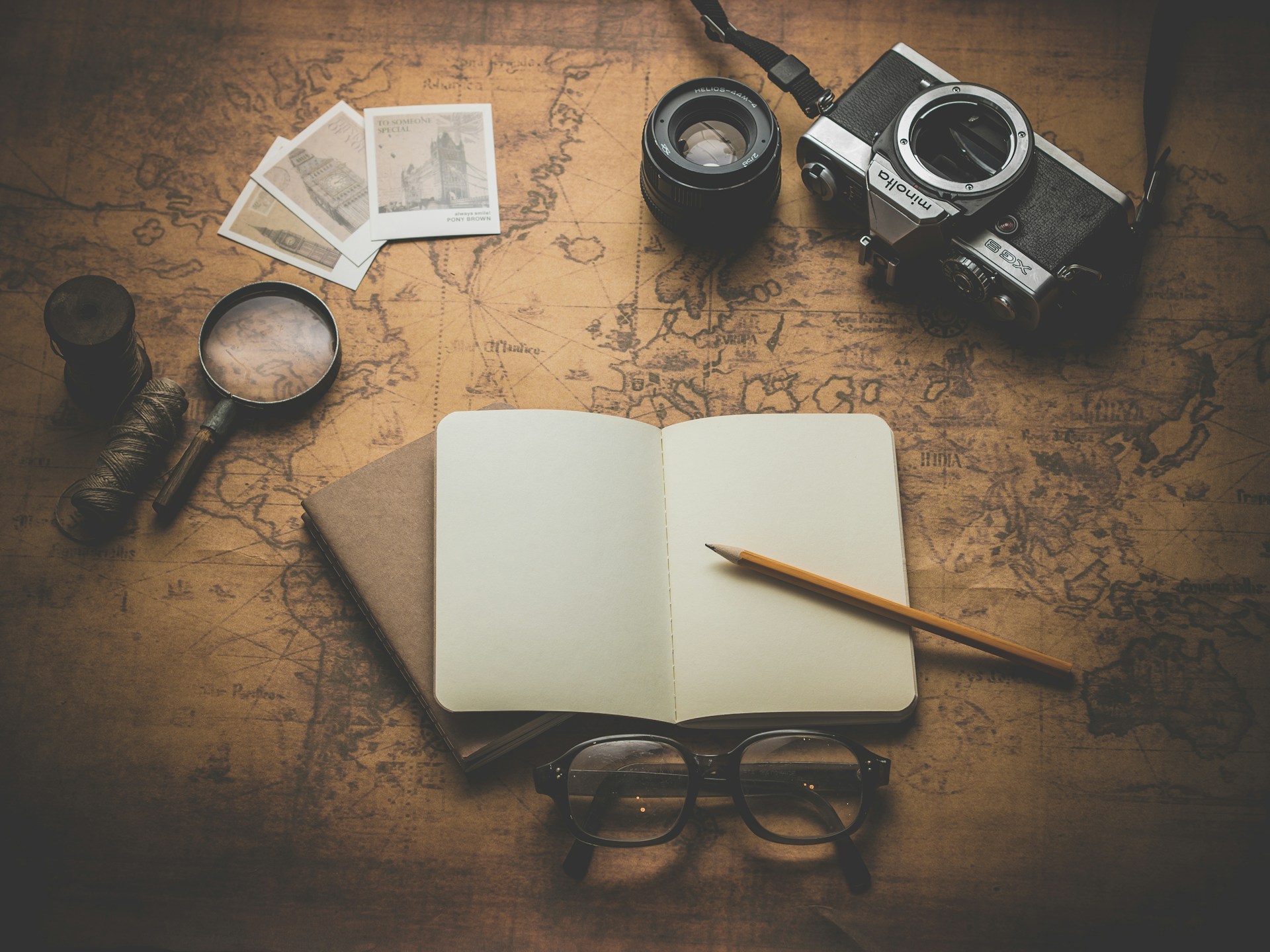A vintage map, passport, and travel notes laid out for trip planning